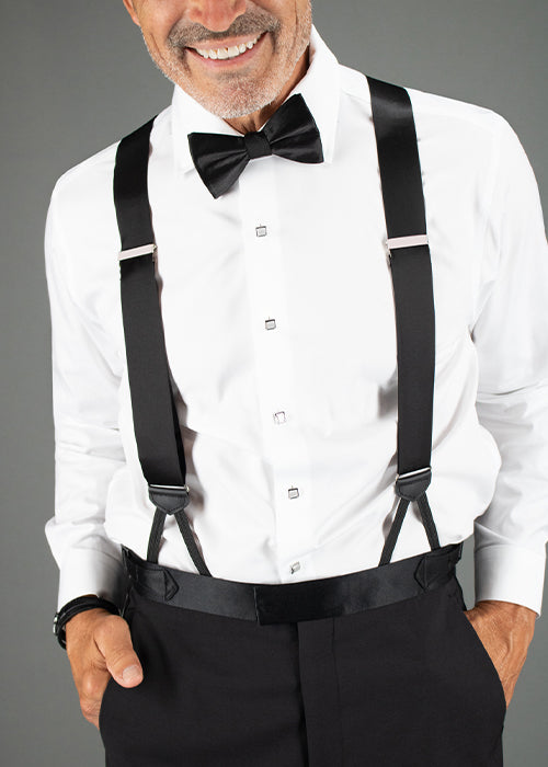 Man wearing black sutton braces and bow tie