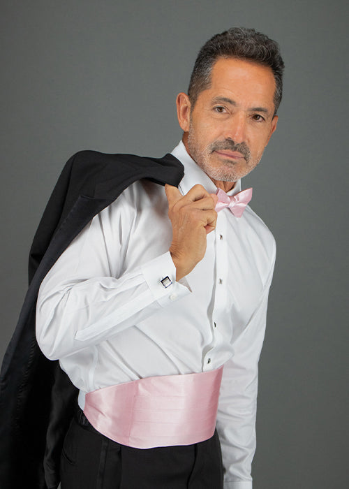 Man wearing the Sutton bow tie and cummerbund in pink