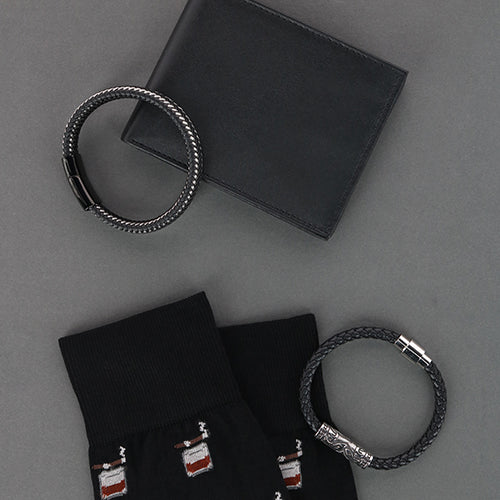 Black leather bracelets, wallets, and bourbon cigar socks